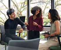 two-ladies-and-a-guy-are-talking-in-the-office