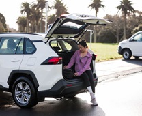 passenger-sitting-in-suv-checking-her-bag