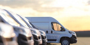 various-white-vans-parking-at-the-parking-lot