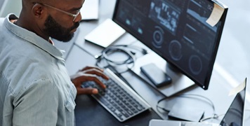 booking-intelligence-man-checking-computer