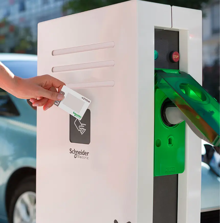 a-lady-is-taping-her-car-on-schneider-machine