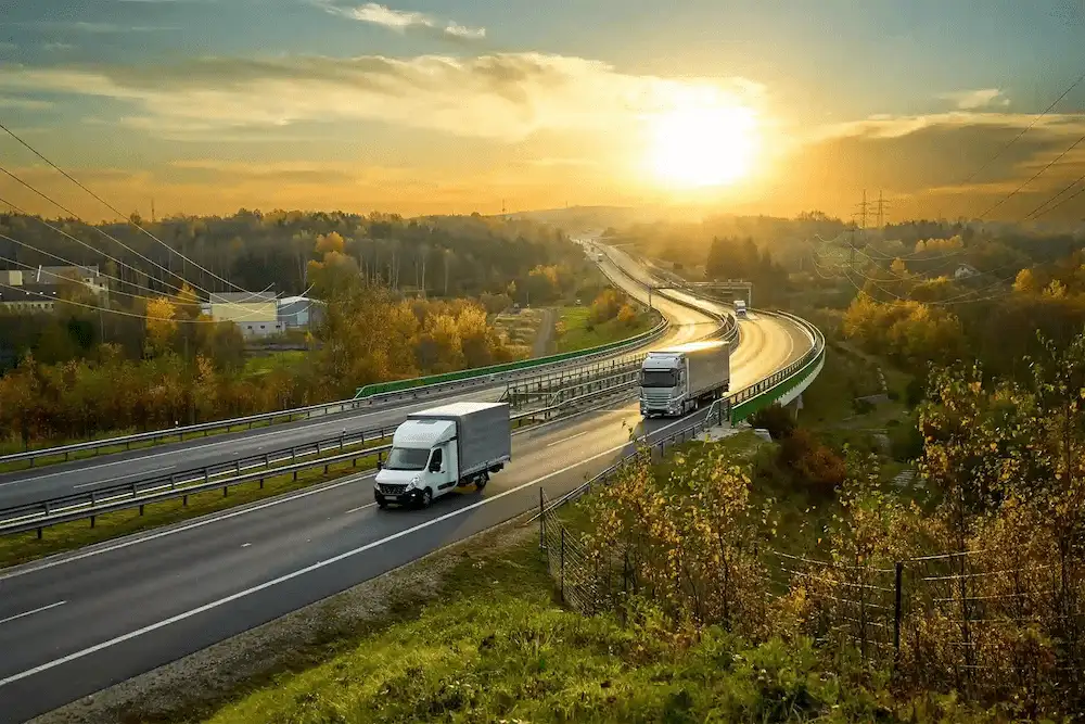 truck and van driving on the country road