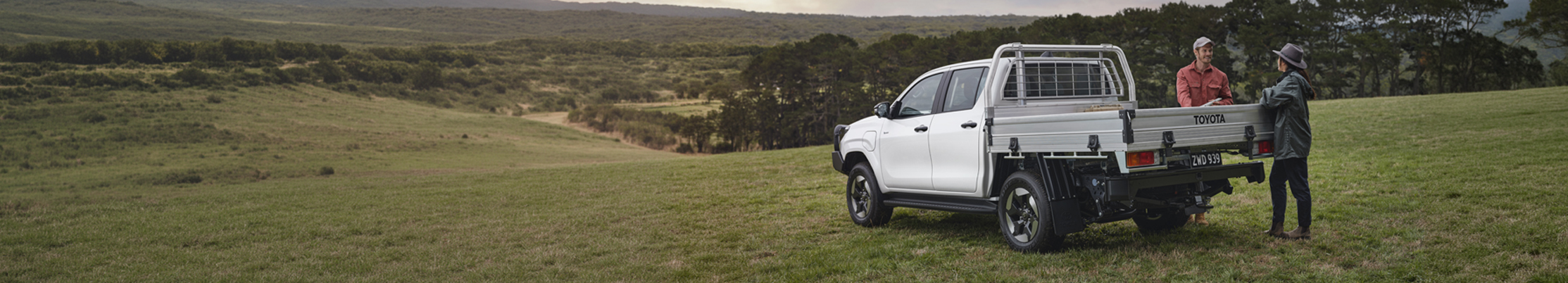 Toyota ute parked in open field