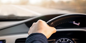car-interior-man-driving-close-up-of-wheel