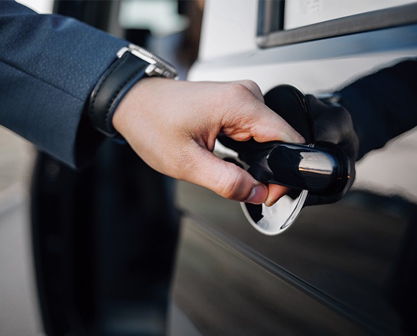 close-up-of-business-professional-opening-car-door close-up-of-business-professional-opening-car-door