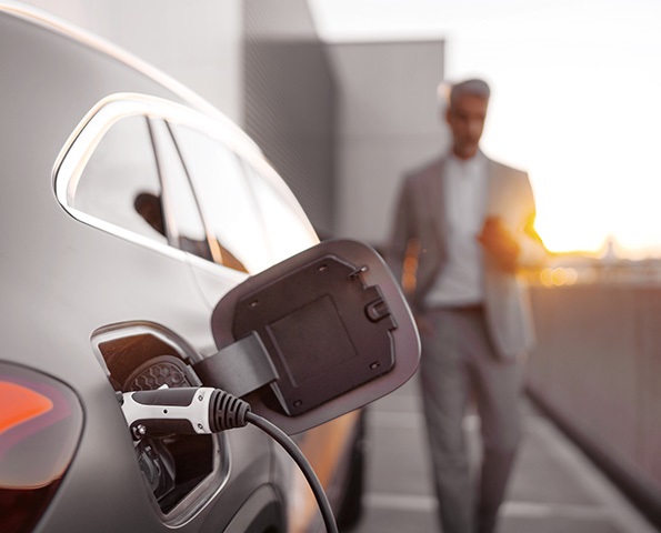 EV-charging-with-male-in-background