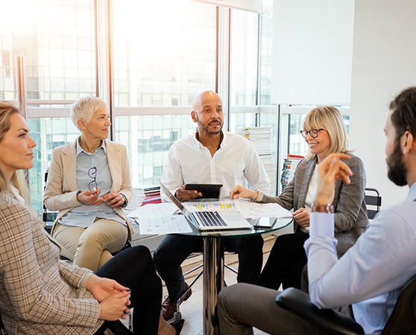 group-of-professionals-having-discussion-in-an-office-setting