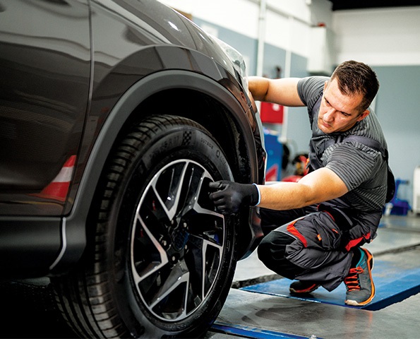 mechanic-checking-car-tyre mechanic-checking-car-tyre