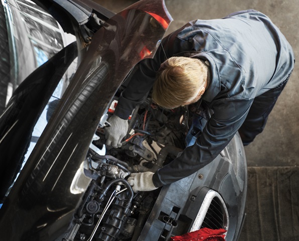 top-view-man-repairing-car top-view-man-repairing-car