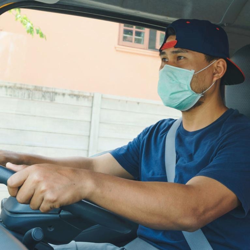 HGV driver with PPE driving