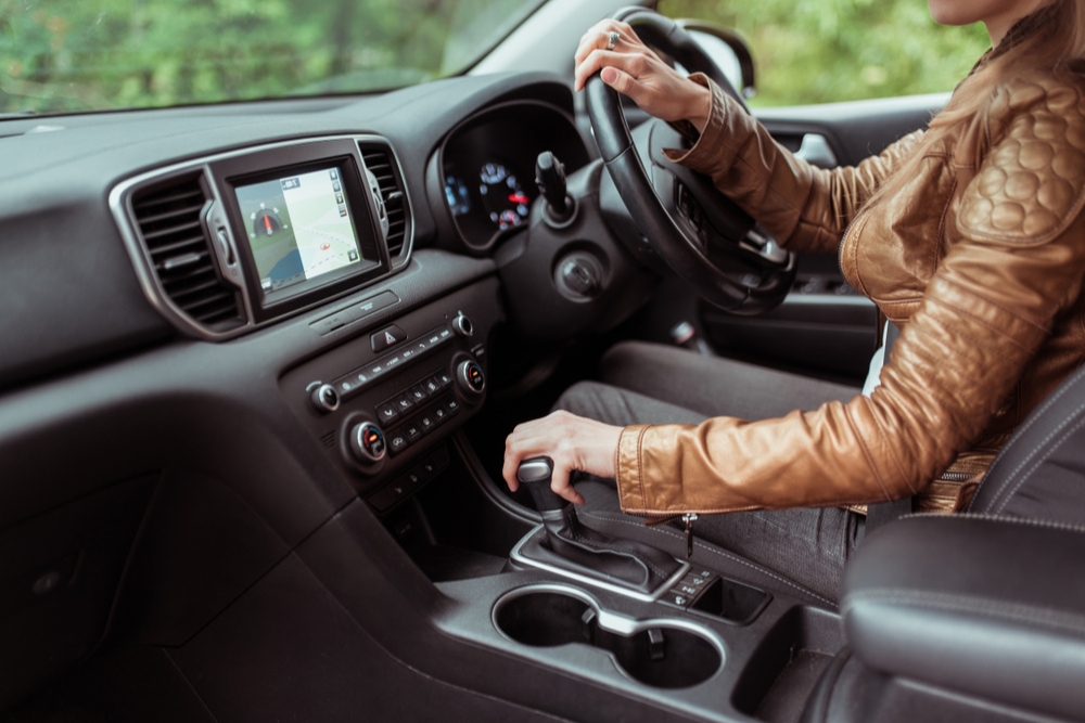 Someone in a leather jacket driving a PHEV on a salary sacrifice scheme
