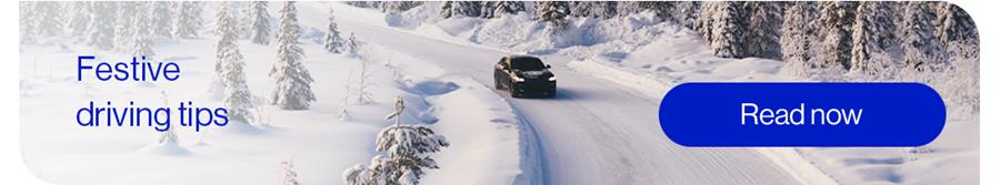 Car driving on snowy road with read now button