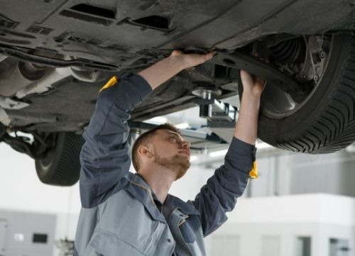 mechanic under car