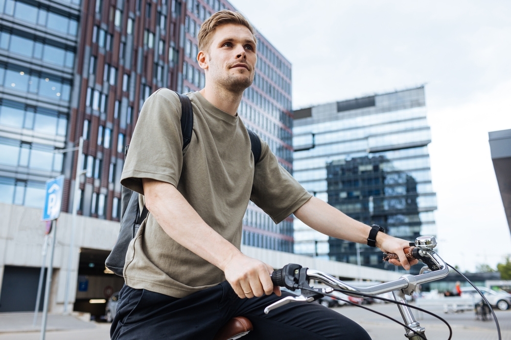 someone driving a non-descript e-bike shot from the waist up