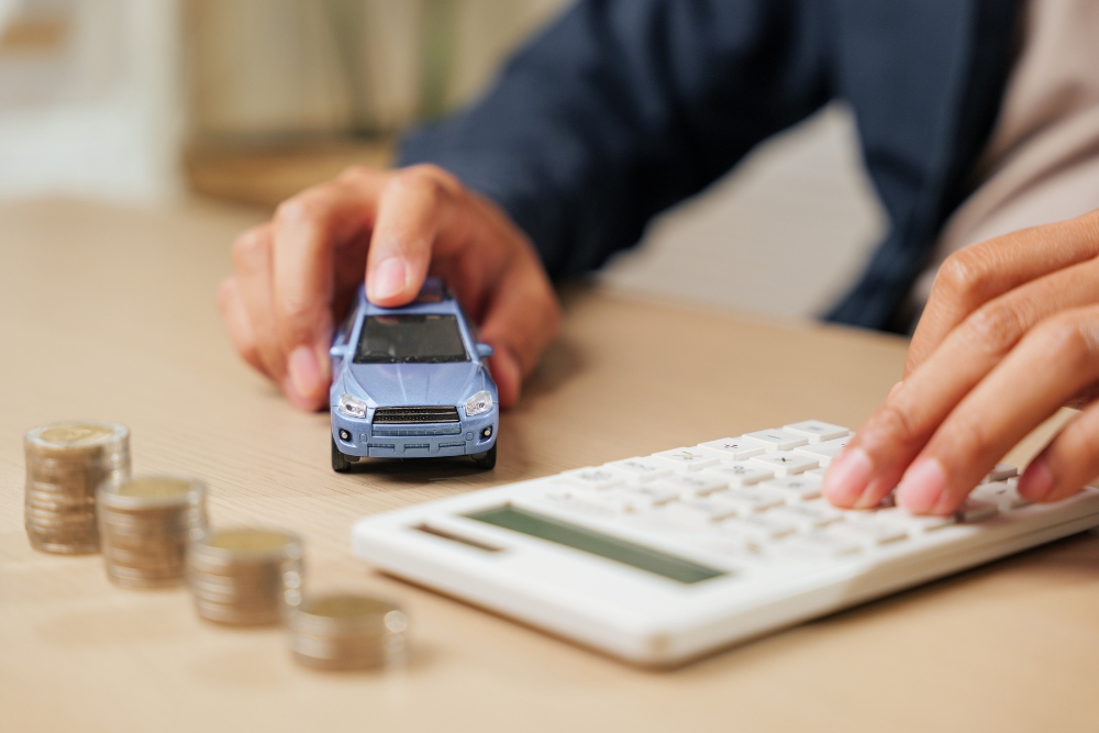 a model car next to a calculator
