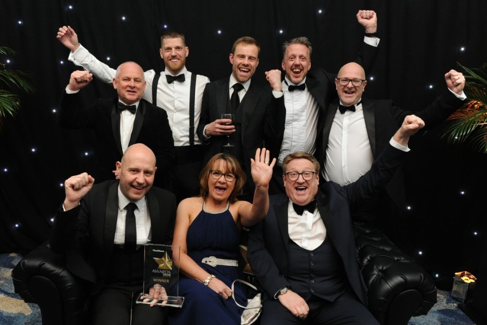 A celebratory image of the SG Fleet team with the leasing company of the year award